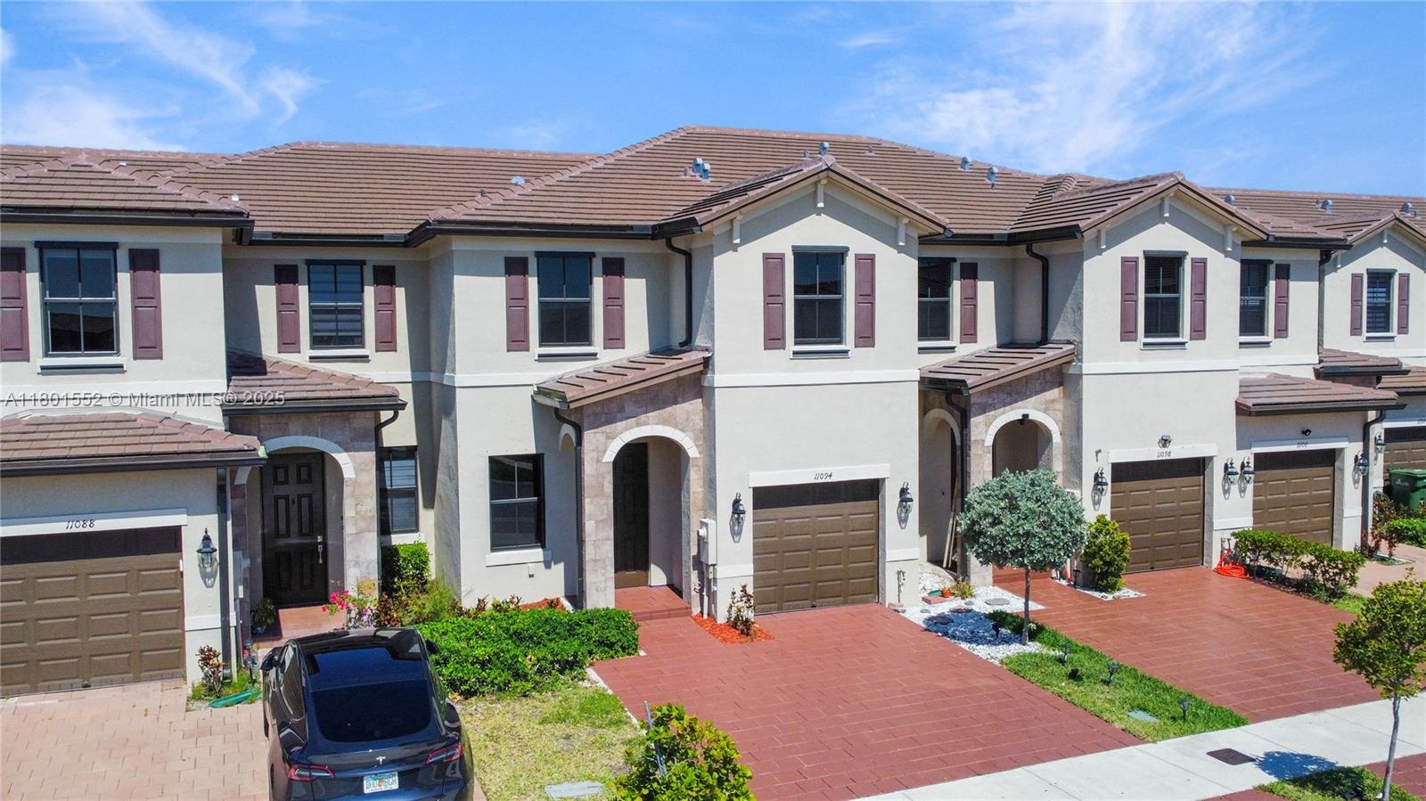 11094 West 33rd Way Hialeah, FL 33018 - Photo 41 of 46 a front view of a house with a garden