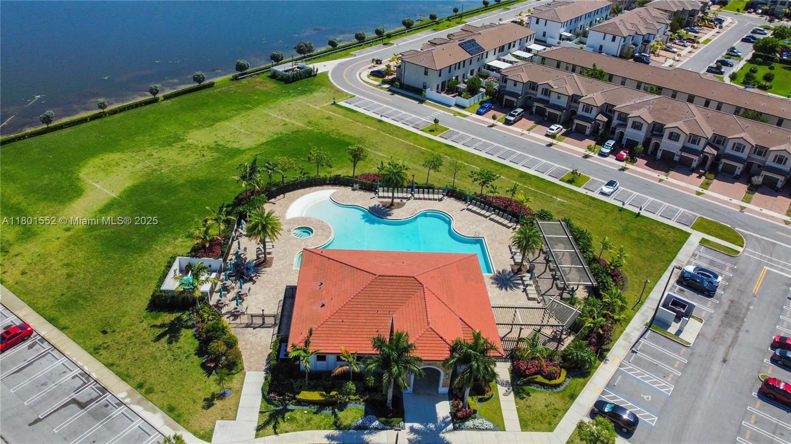 11094 West 33rd Way Hialeah, FL 33018 - Photo 46 of 46 an aerial view of a tennis ground and a cars park side of the ocean