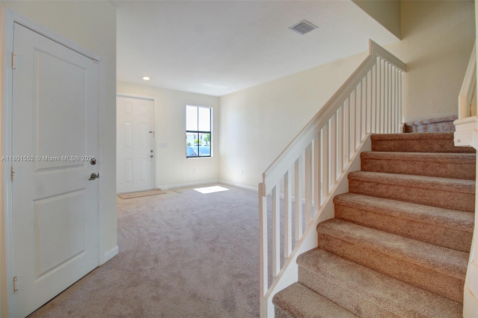 11094 West 33rd Way Hialeah, FL 33018 - Photo 5 of 46 a view of entryway and hall with wooden floor