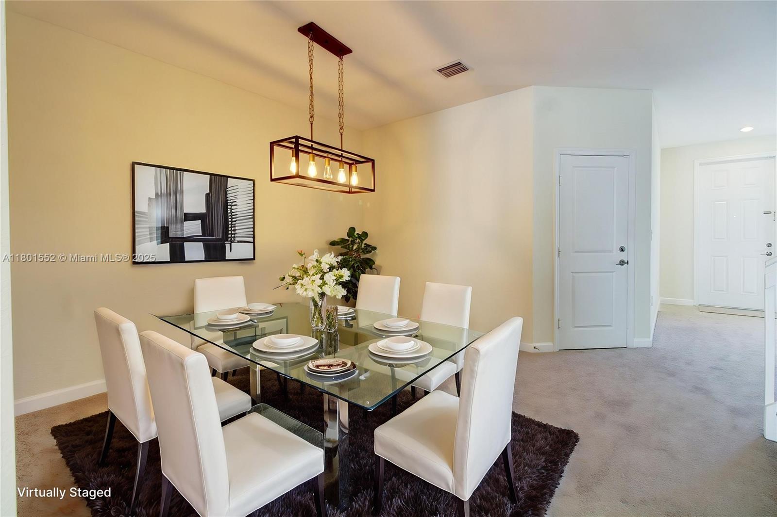 11094 West 33rd Way Hialeah, FL 33018 - Photo 7 of 46 a view of a dining room with furniture and wooden floor