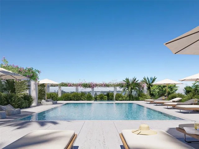 a view of a swimming pool with a patio