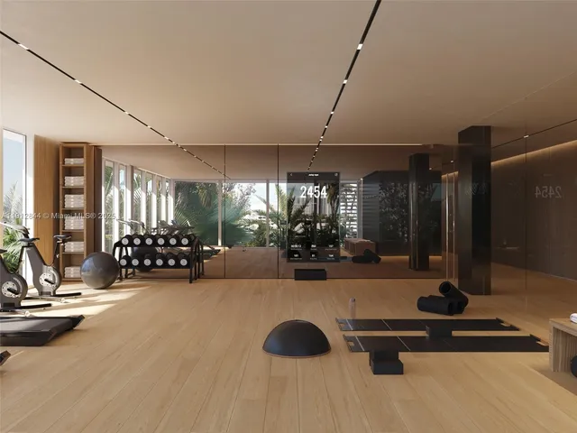 a room with gym equipment and a large window