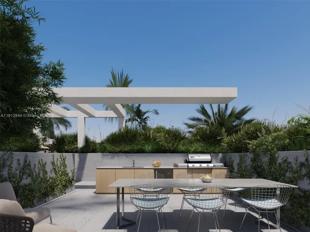 a view of swimming pool with outdoor seating and plants