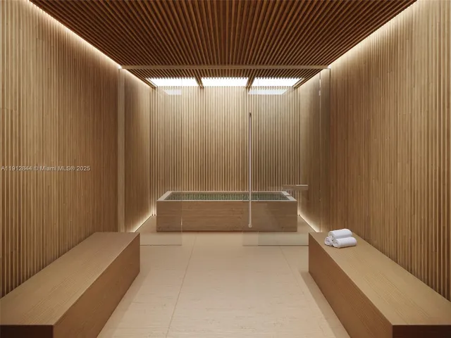 a bathroom with a tub and shower