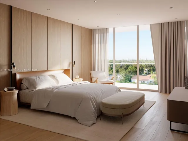 a spacious bedroom with a bed and a large window
