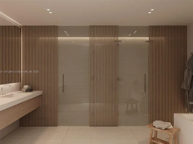 a bathroom with a mirror and a shower