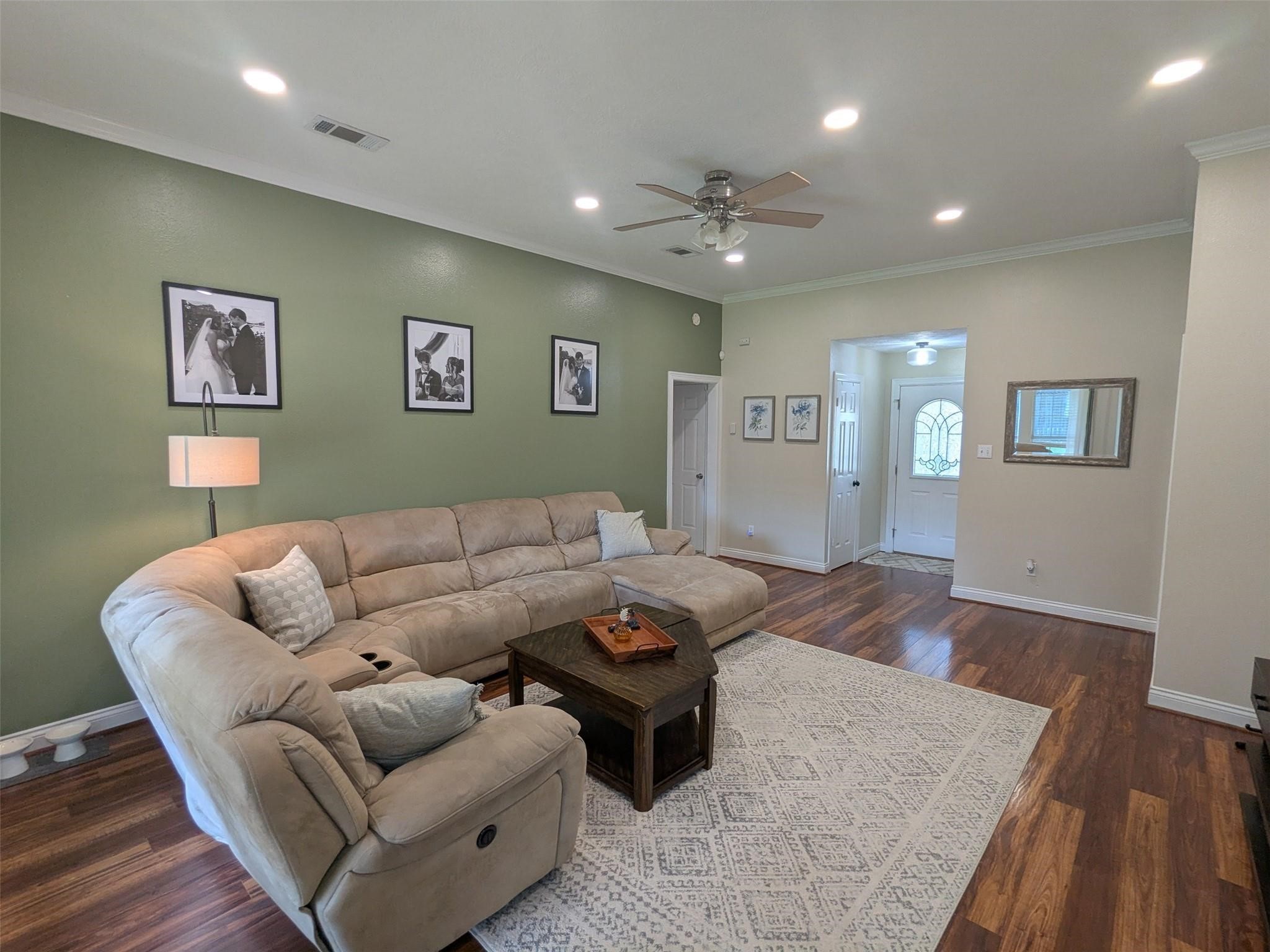 1035 North Colbert Street Dayton, TX 77535 - Photo 4 of 17 High ceilings, beautiful laminate floors.