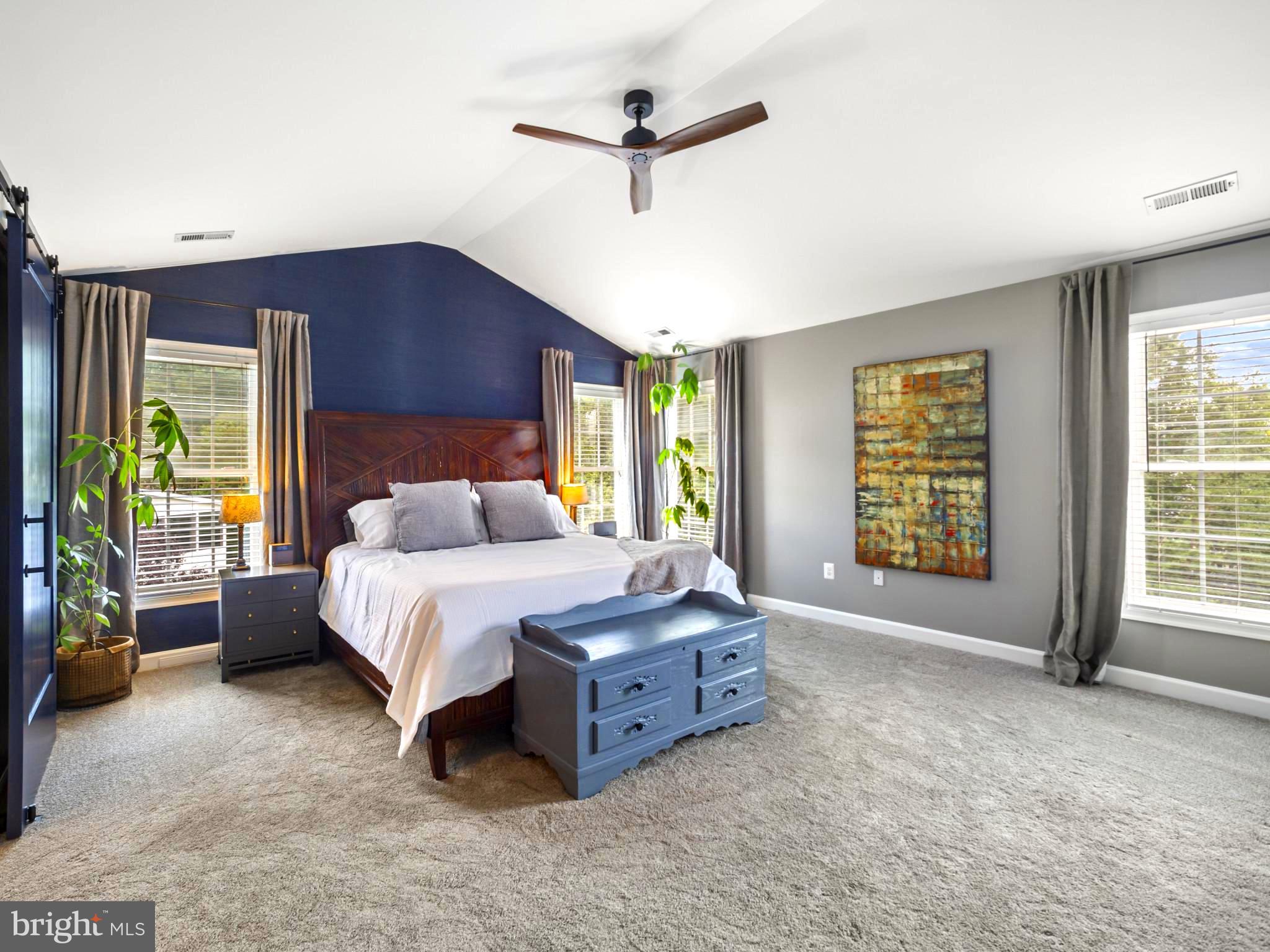 733 Seneca Drive Odenton, MD 21113 - Photo 27 of 83 a spacious bedroom with a bed and a ceiling fan