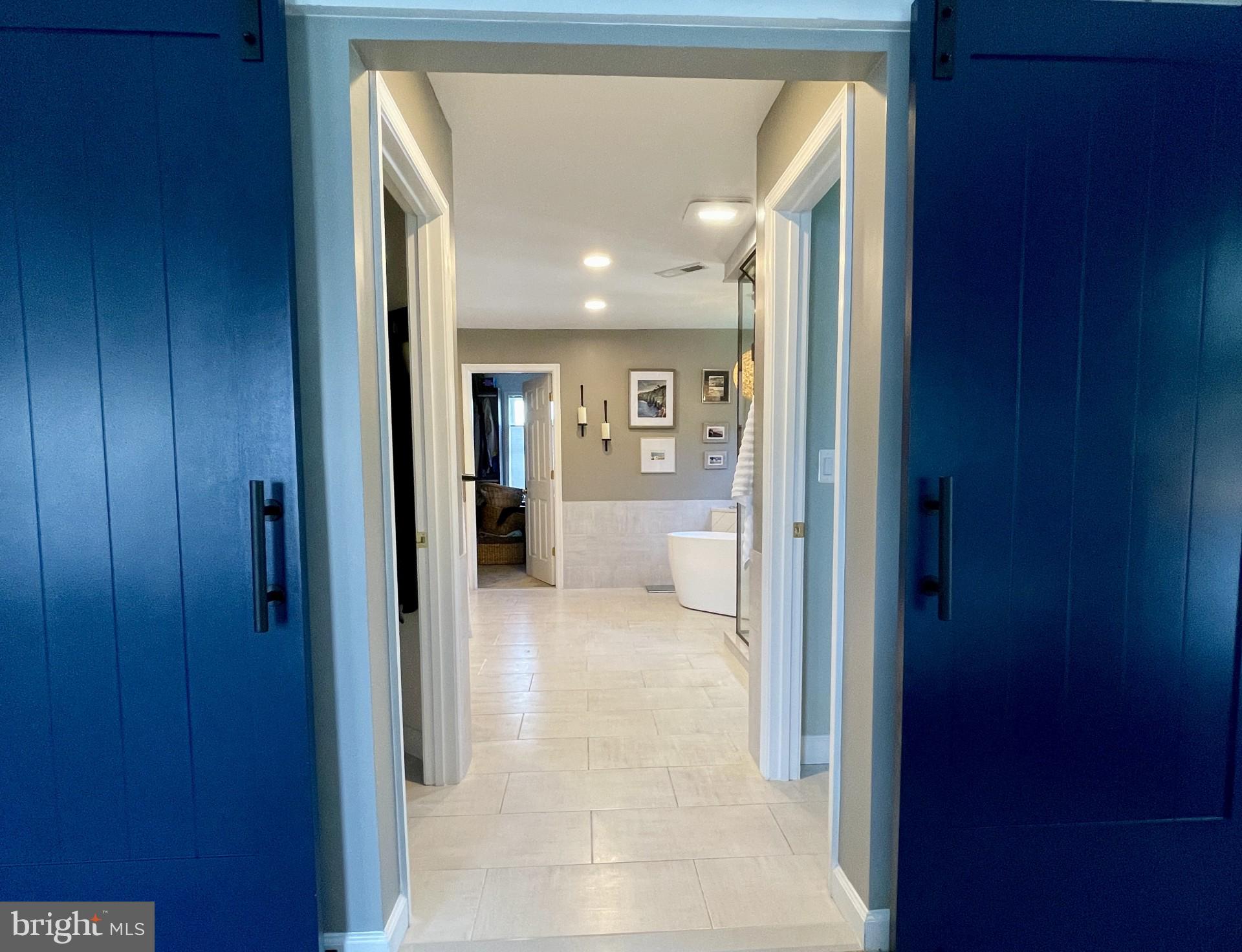 733 Seneca Drive Odenton, MD 21113 - Photo 30 of 83 a view of a hallway with a livingroom and a bathroom with a sink