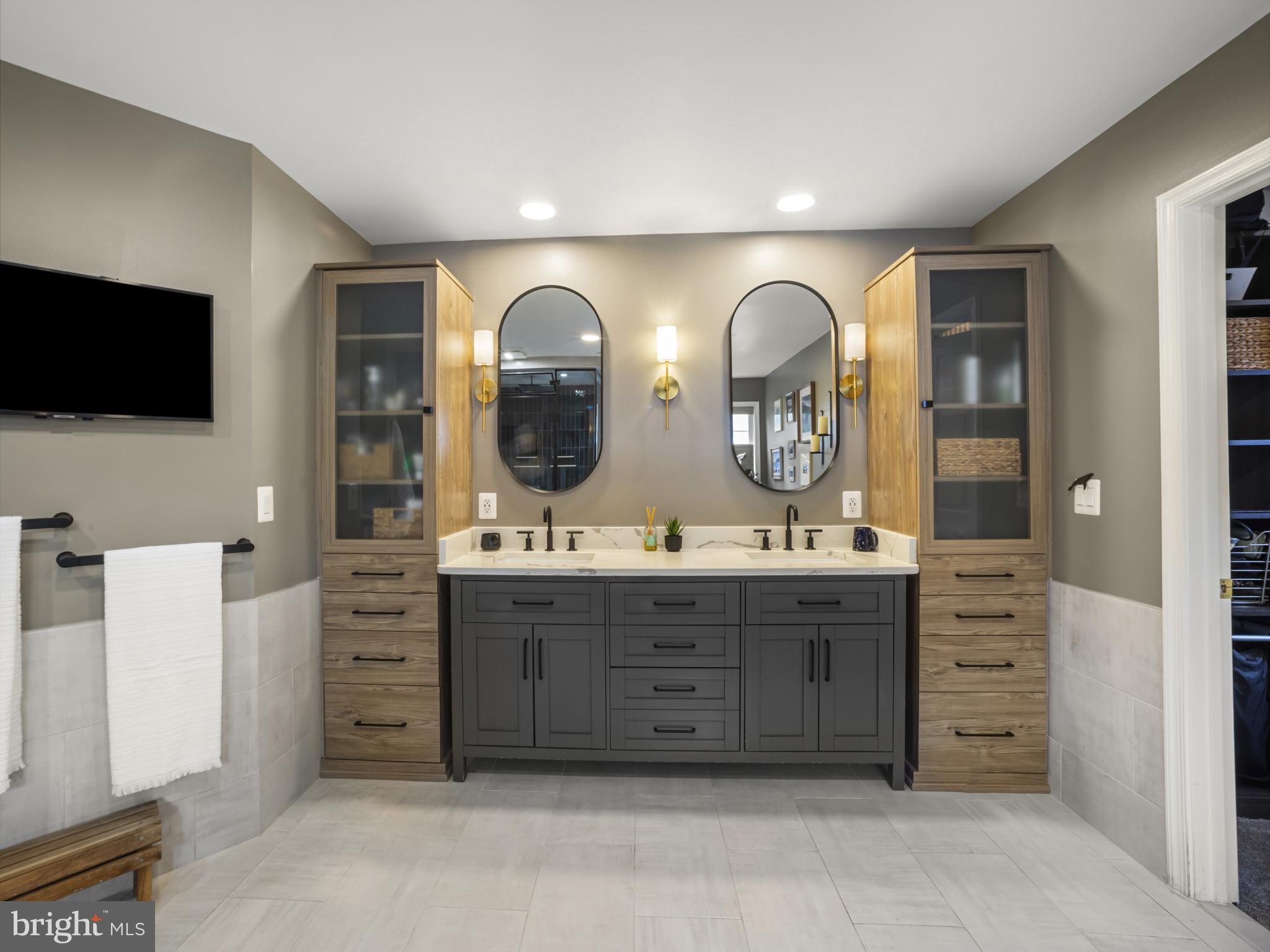 733 Seneca Drive Odenton, MD 21113 - Photo 37 of 83 a spacious bathroom with a granite countertop sink and a large mirror