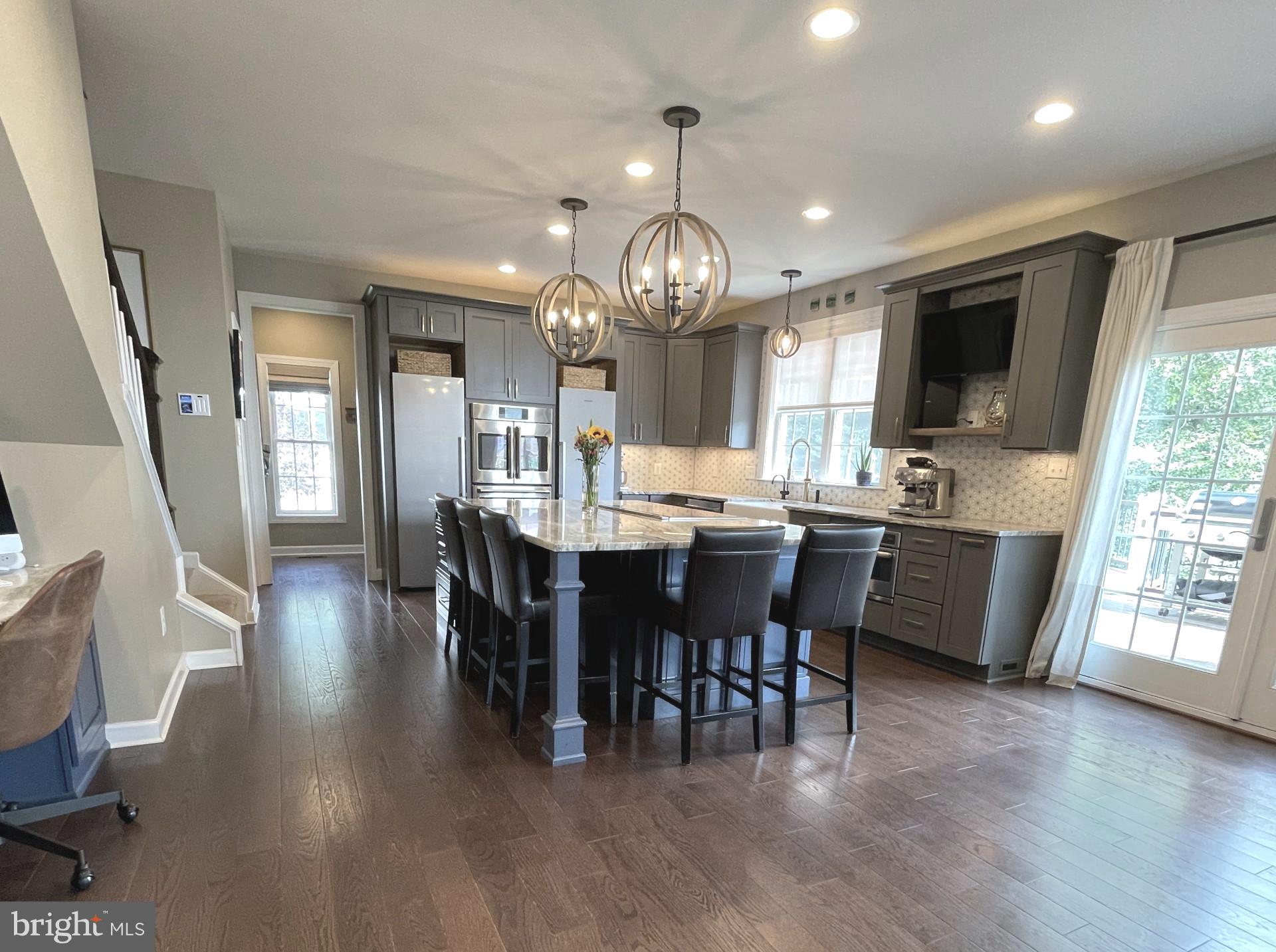 733 Seneca Drive Odenton, MD 21113 - Photo 5 of 83 a large kitchen with a table and chairs