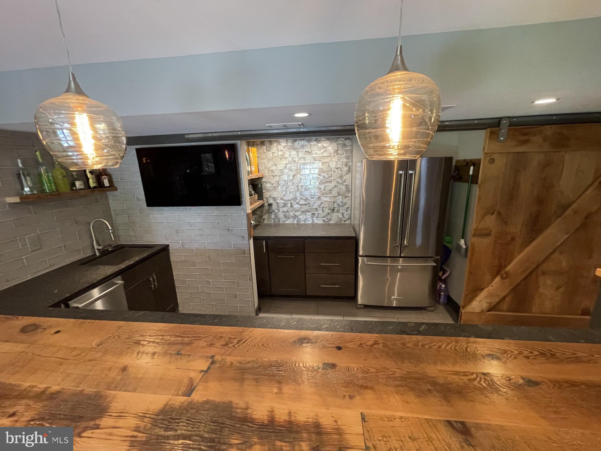 733 Seneca Drive Odenton, MD 21113 - Photo 58 of 83 a kitchen with stainless steel appliances granite countertop a sink a stove and a refrigerator