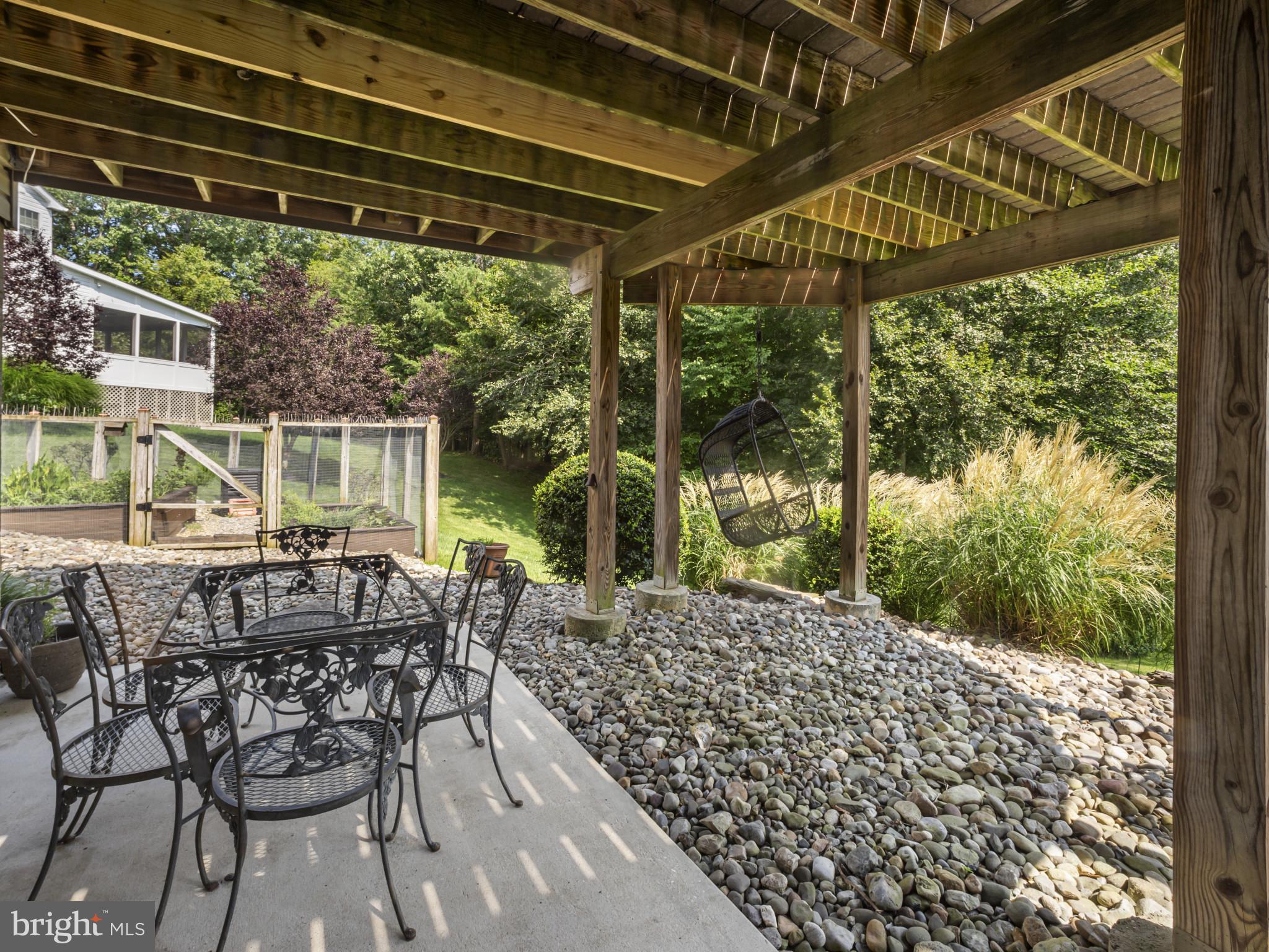 733 Seneca Drive Odenton, MD 21113 - Photo 65 of 83 a patio with yard glass top table and chairs