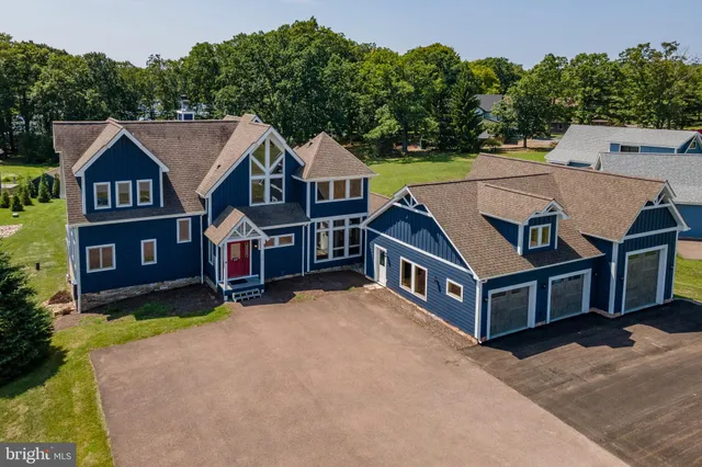 a living room with fireplace furniture and a flat screen tv