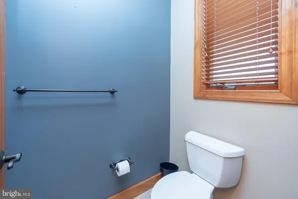 a room with pool table and window
