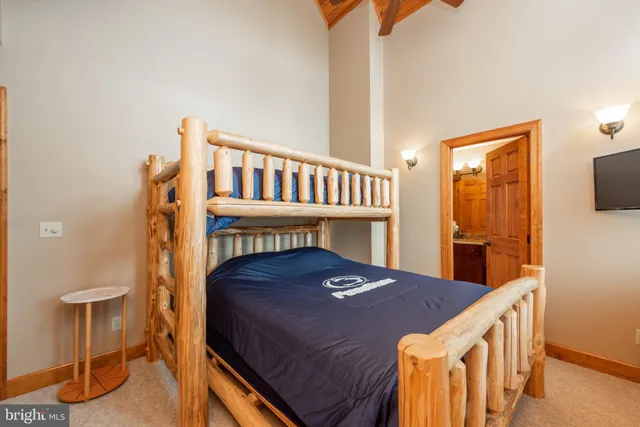 a bathroom with a tub a sink and a large mirror