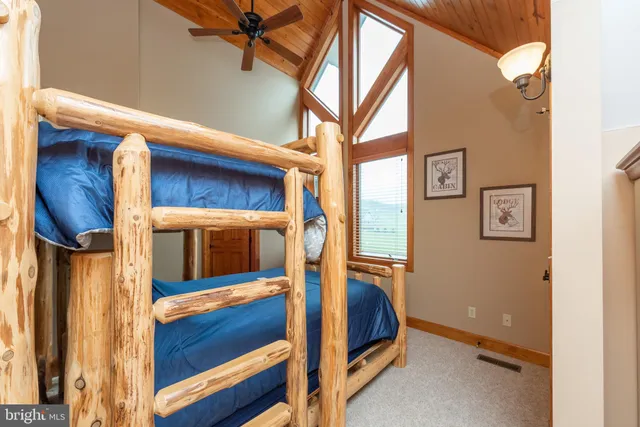 a white toilet sitting next to a white wall