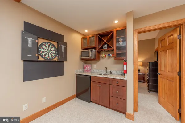 a view of a patio with table and chairs