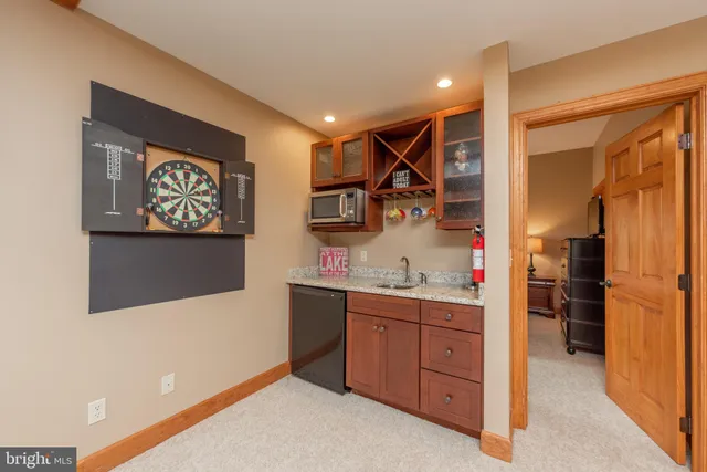 a view of a patio with table and chairs
