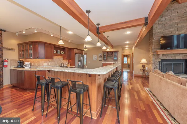 a spacious bedroom with a large bed and a large window