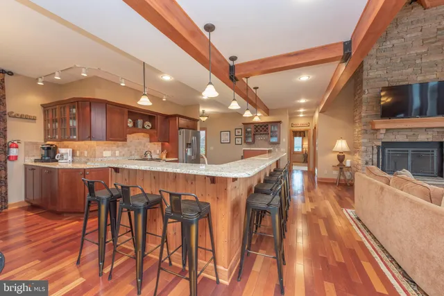 a spacious bedroom with a large bed and a large window