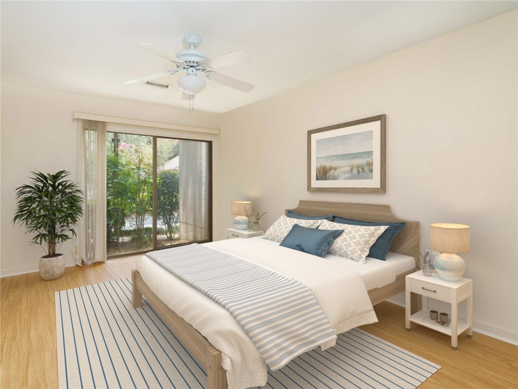 3309 Sea Marsh Road, Unit 3309 Fernandina Beach, FL 32034 - Photo 13 of 34 a bedroom with a large bed and a large window