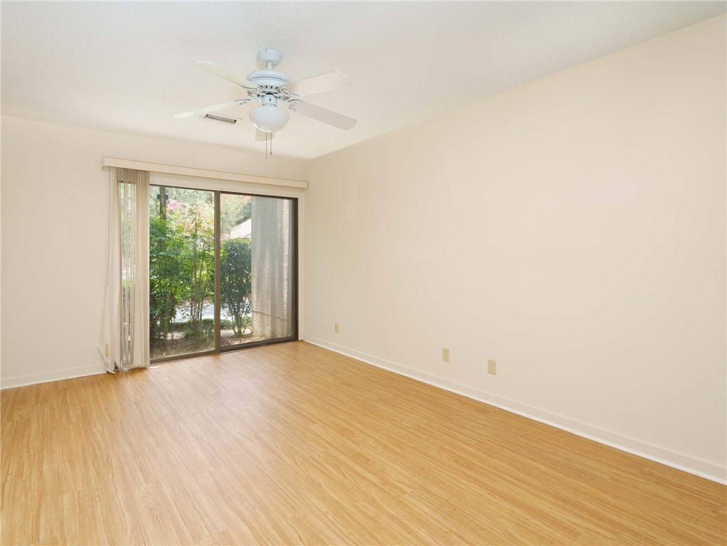 3309 Sea Marsh Road, Unit 3309 Fernandina Beach, FL 32034 - Photo 14 of 34 wooden floor in an empty room with a window
