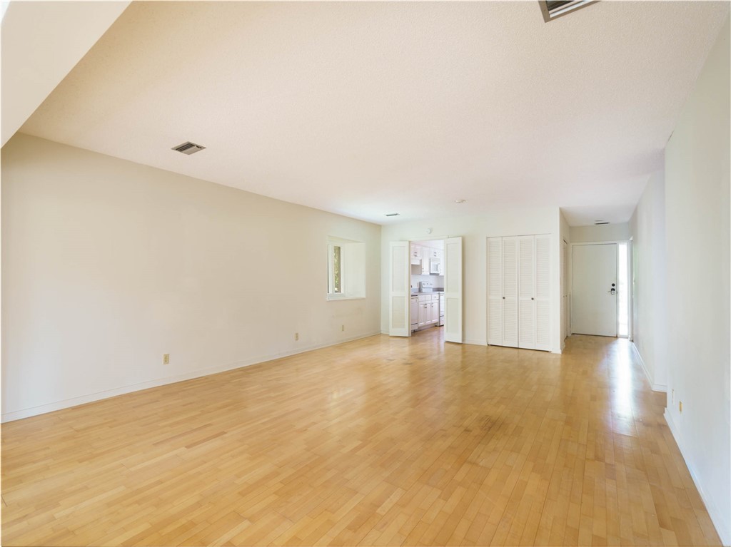 3309 Sea Marsh Road, Unit 3309 Fernandina Beach, FL 32034 - Photo 20 of 34 a view of an empty room with wooden floor