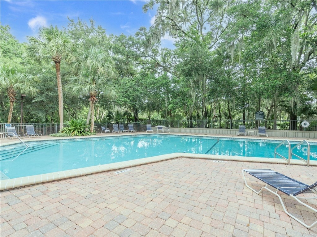 3309 Sea Marsh Road, Unit 3309 Fernandina Beach, FL 32034 - Photo 2 of 34 a view of a yard with large trees
