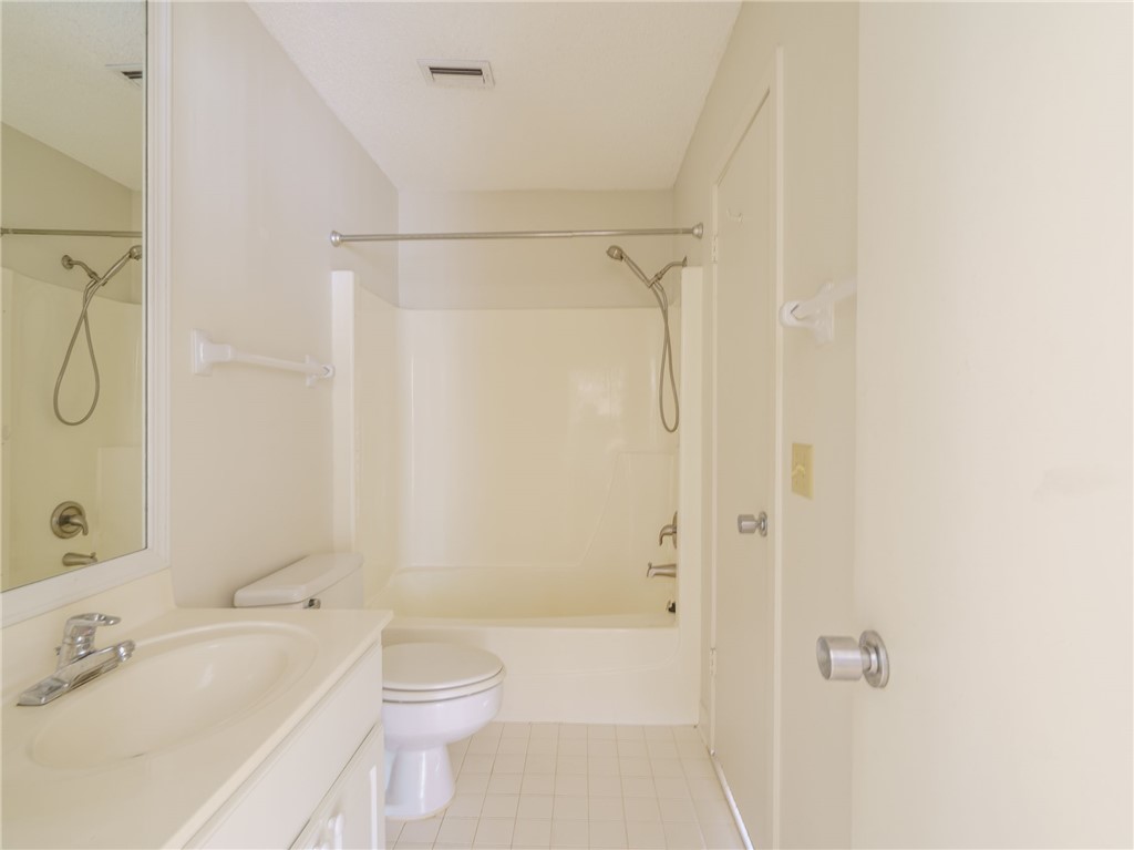 3309 Sea Marsh Road, Unit 3309 Fernandina Beach, FL 32034 - Photo 26 of 34 a bathroom with a sink a toilet and shower