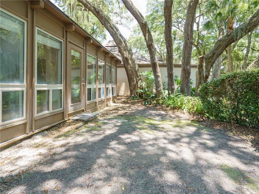 3309 Sea Marsh Road, Unit 3309 Fernandina Beach, FL 32034 - Photo 29 of 34 a view of a house with a yard and tree