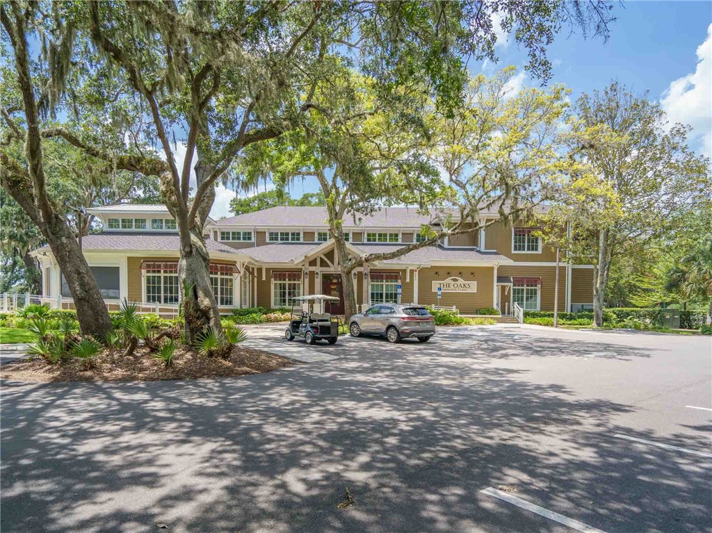 3309 Sea Marsh Road, Unit 3309 Fernandina Beach, FL 32034 - Photo 32 of 34 a front view of a house with a garden