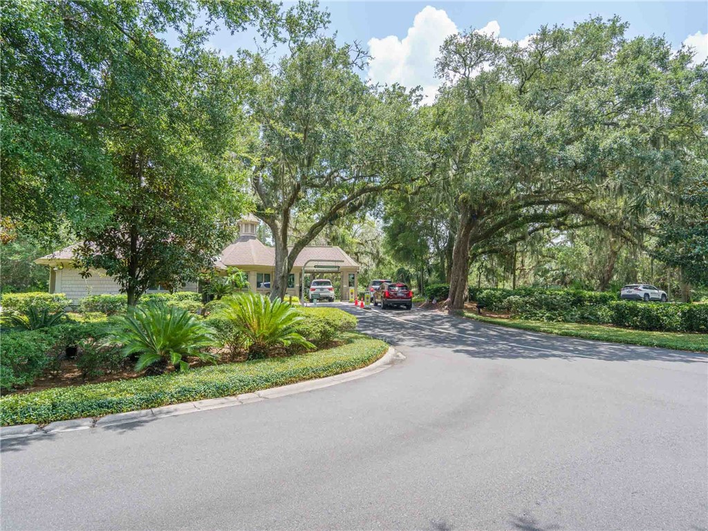 3309 Sea Marsh Road, Unit 3309 Fernandina Beach, FL 32034 - Photo 33 of 34 a front view of a house with a yard and outdoor seating