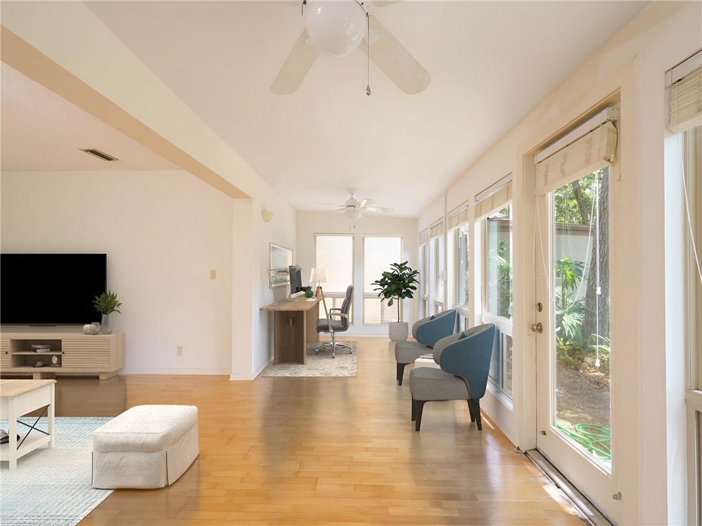 3309 Sea Marsh Road, Unit 3309 Fernandina Beach, FL 32034 - Photo 5 of 34 a living room with furniture and a flat screen tv