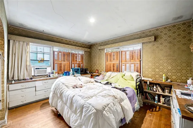 a bathroom with a sink and mirror with toilet