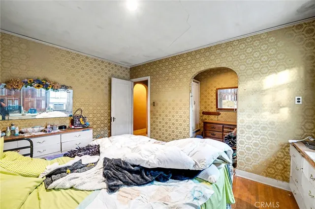 a bathroom with a glass door shower and toilet