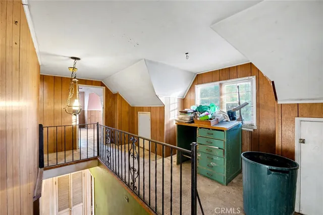 a bedroom with furniture and a window