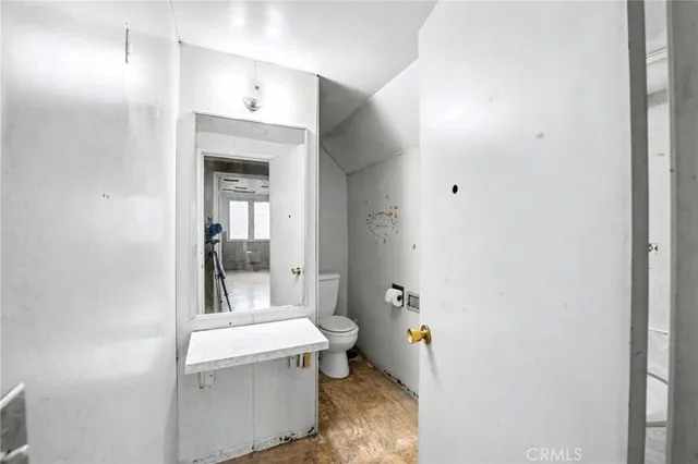 a view of a patio with table and chairs potted plants and large tree