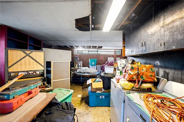 an aerial view of residential house and sandy dunes