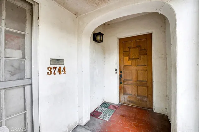 a bed room with furniture and a window