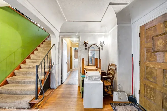 a room with lots of furniture and white walls