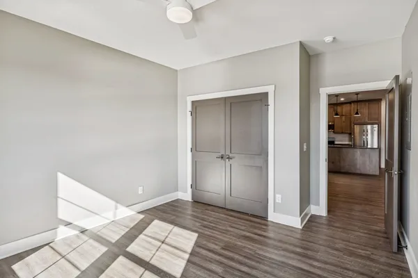 a view of an empty room and wooden floor