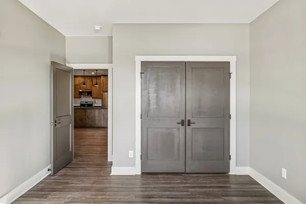 wooden floor and closet in a room
