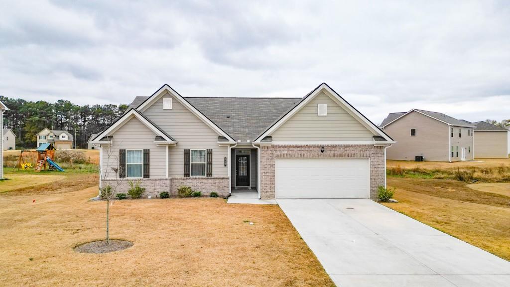 202 Cornwell Way Calhoun, GA 30701 - Photo 1 of 1 a view of a house with a yard