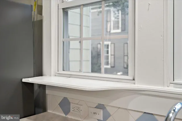 a view of a porch with wooden floor and fence