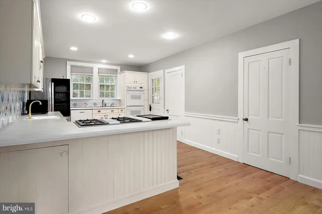 a view of a field with trees in the background