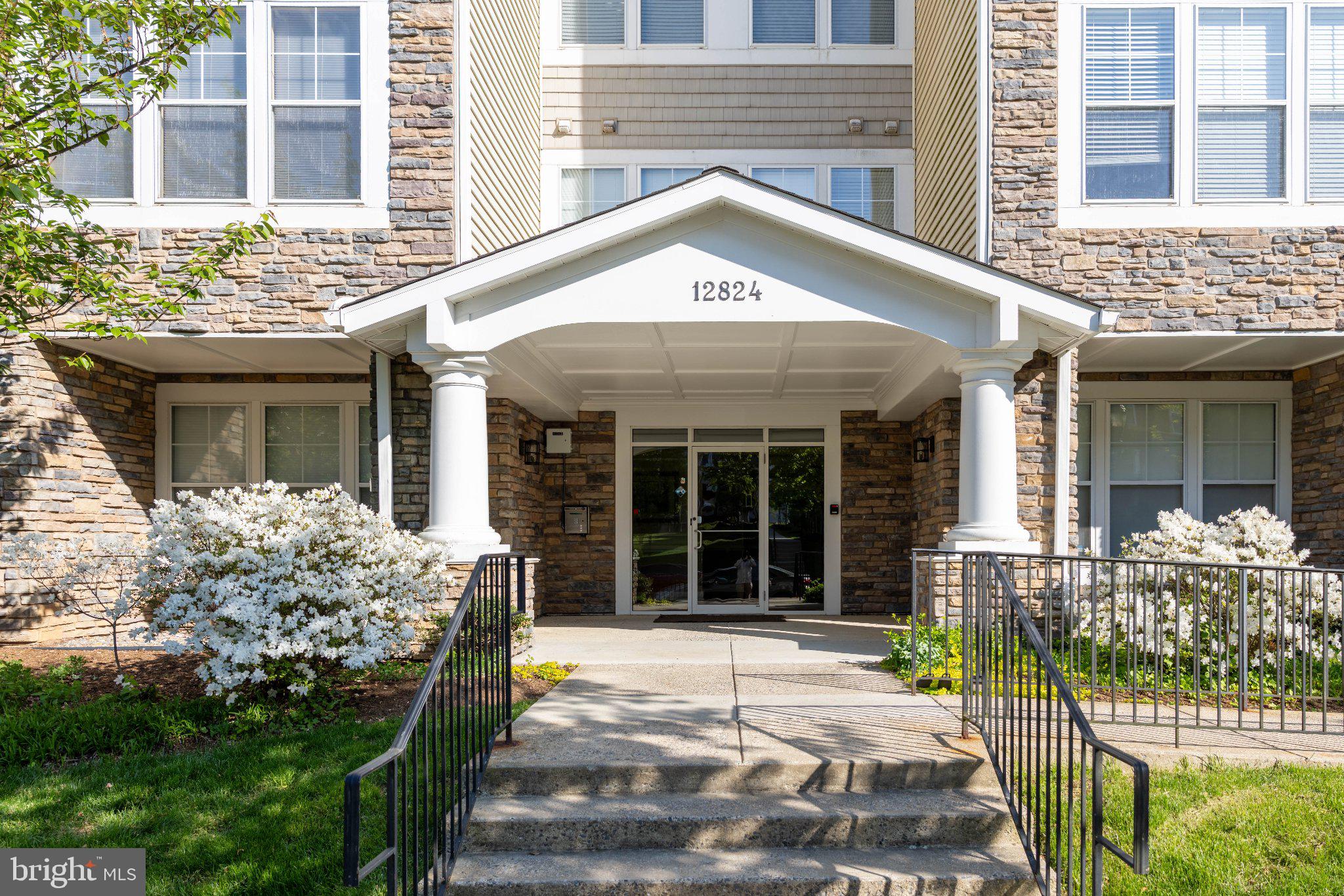 12824 Clarksburg Square Road, Unit 105 Clarksburg, MD 20871 - Photo 2 of 96 Charming entrance with lush greenery.