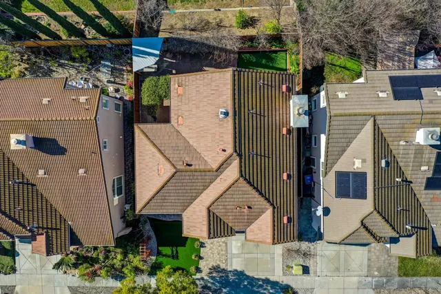 an aerial view of a house with a garden