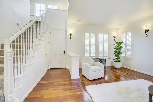 a spacious bedroom with a bed and a couch