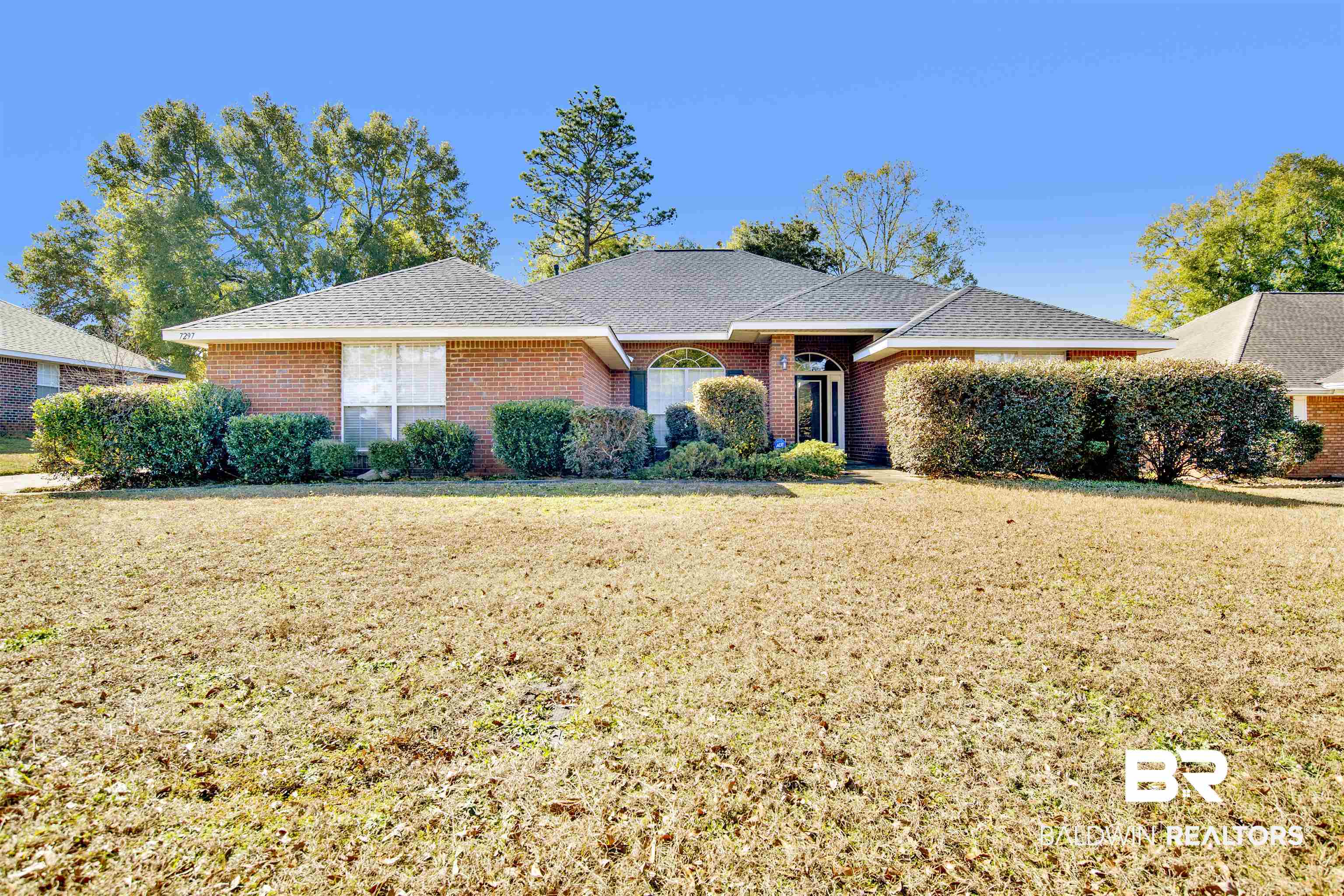 7297 Bridgemill Drive Mobile, AL 36619 - Photo 1 of 33 Ranch-style house with a front lawn and brick siding